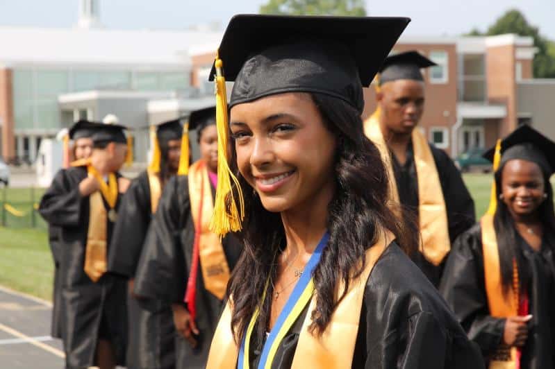 A woman in a graduation uniform